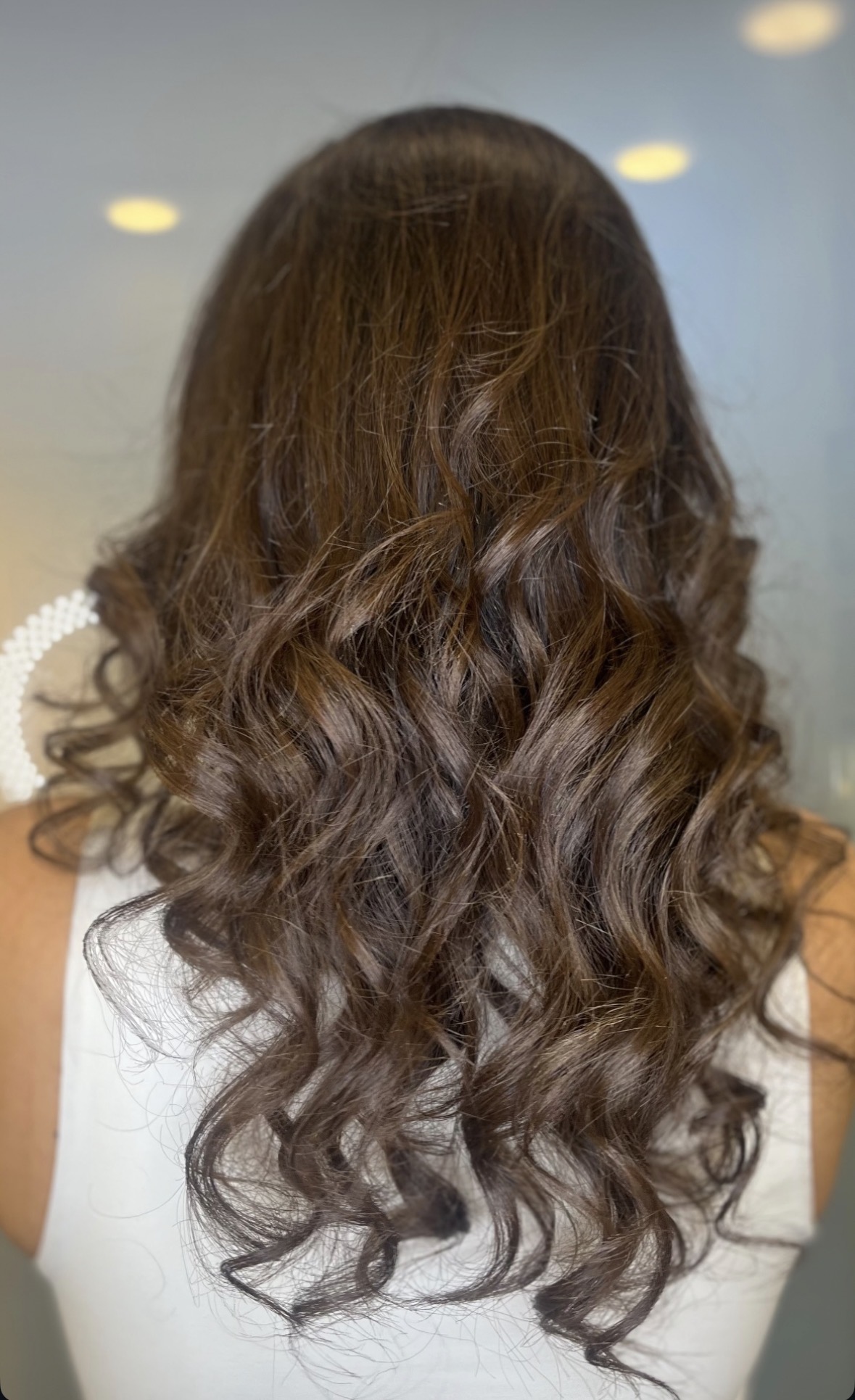 Long hair styled in soft, defined curls
