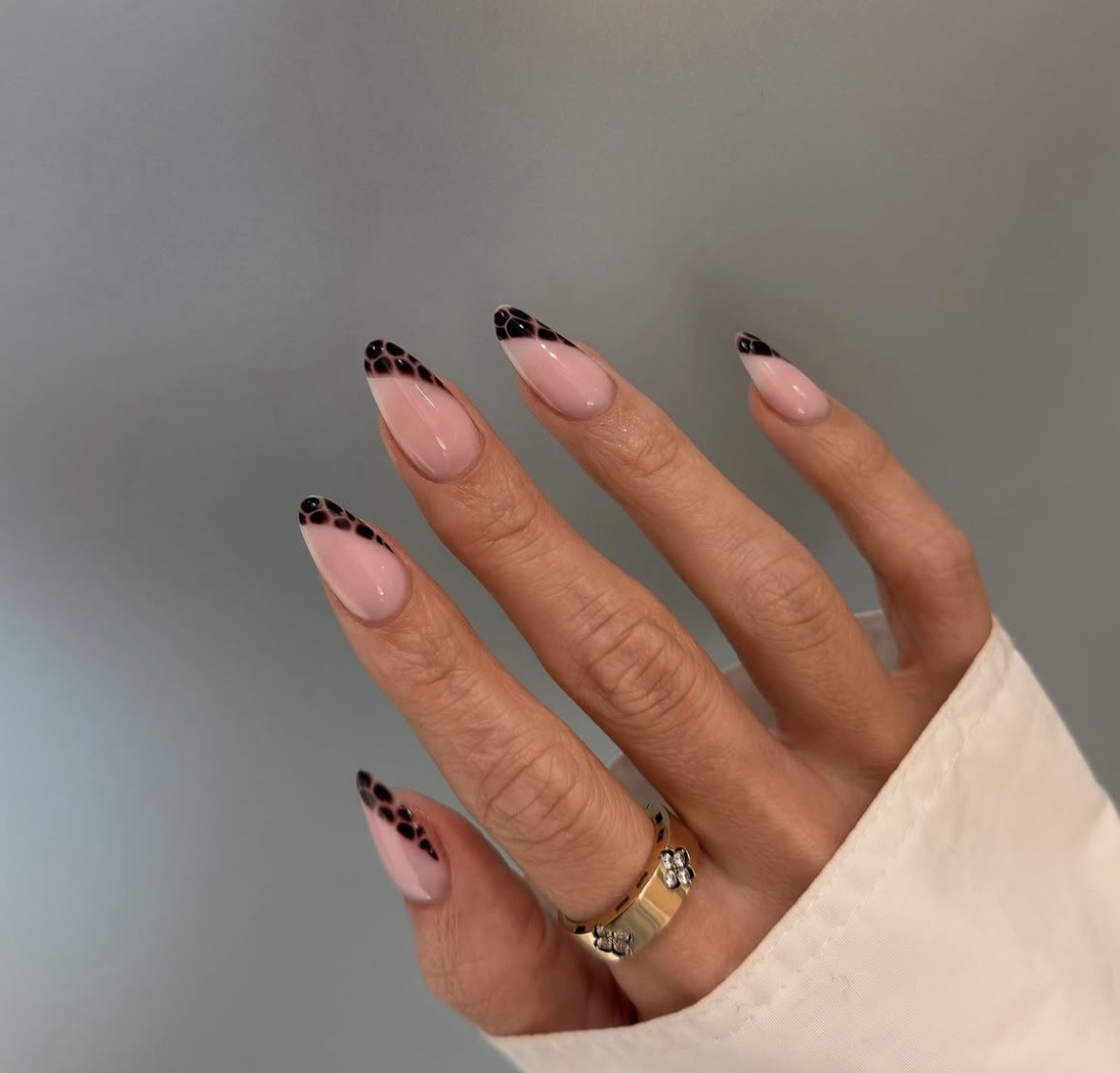 Pink almond nails with fine black detail