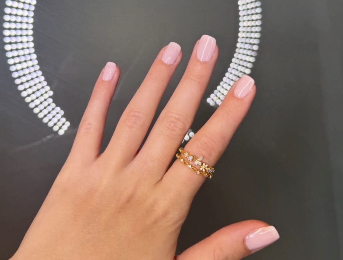 Soft pink manicure finished with a delicate shine